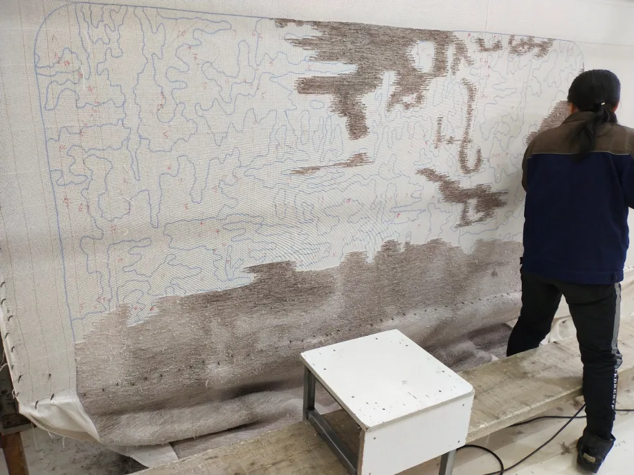 LESS handmade carpet installed on retail floor